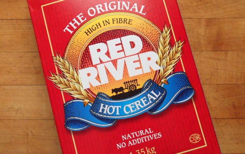 A box of Red River Cereal on a table top