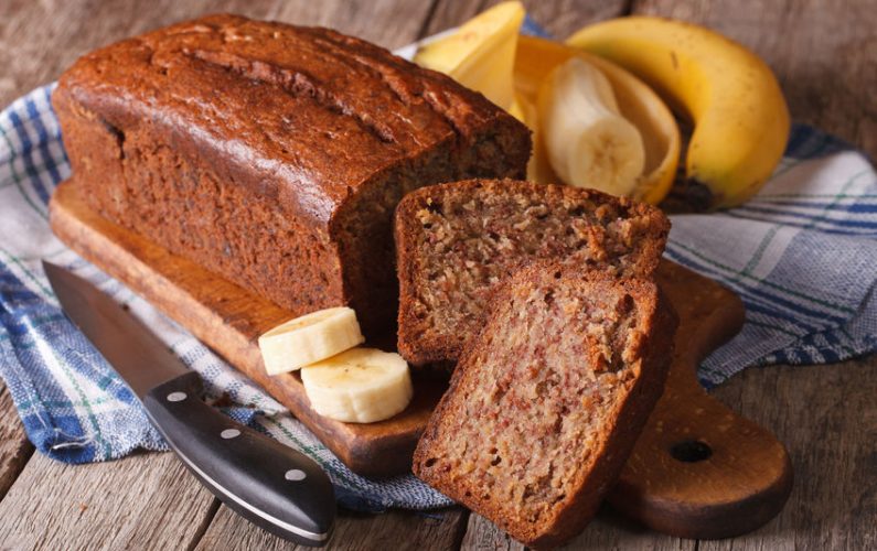 Homemade banana bread sliced on a table close-up. horizontal, rustic style
