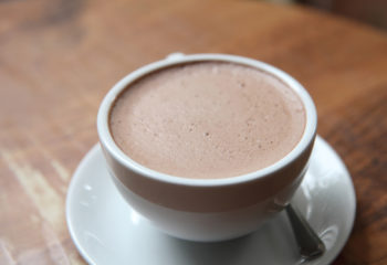 hot chocolate in a white cup on a table